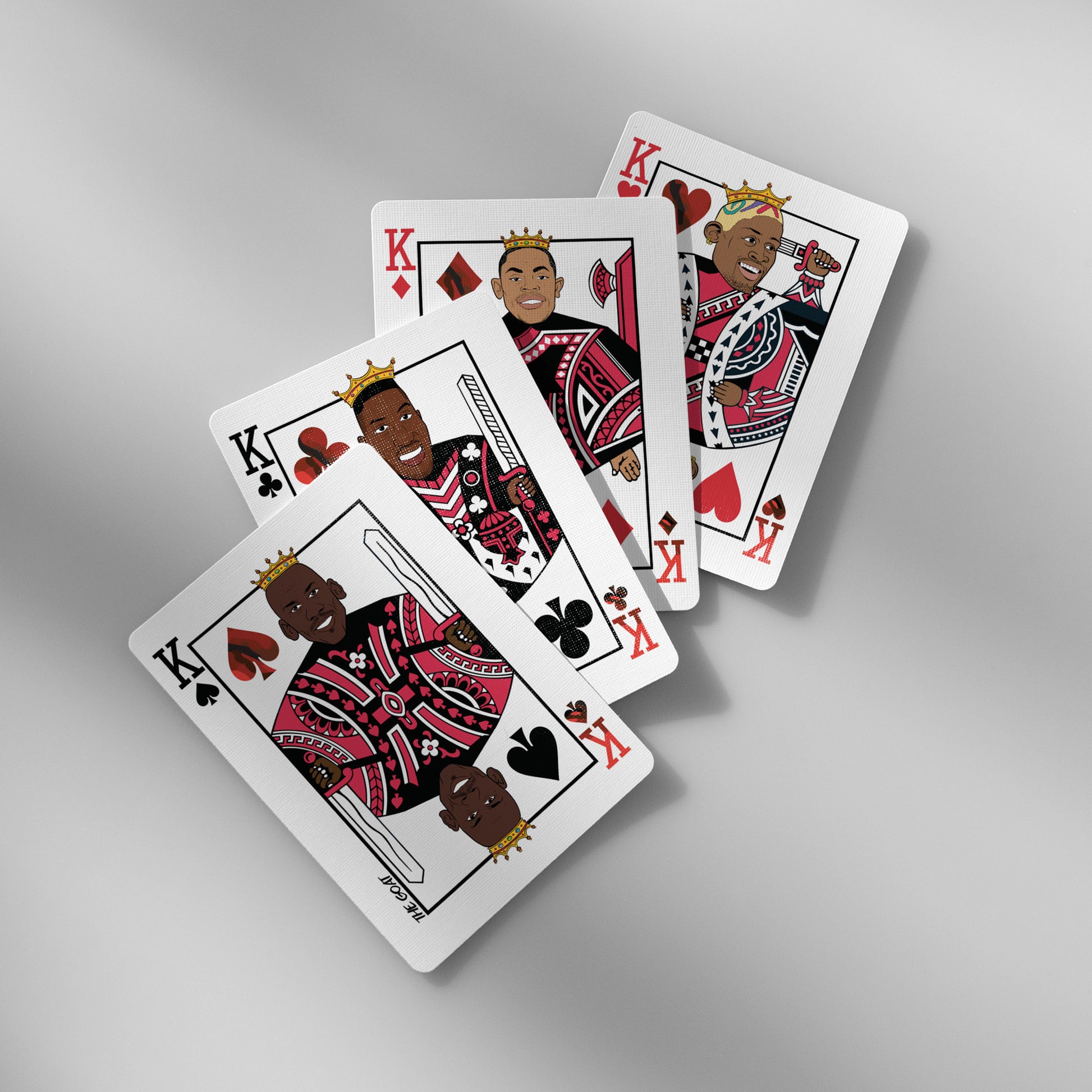 Close-up of Bulls playing cards showing King face cards with iconic player caricatures